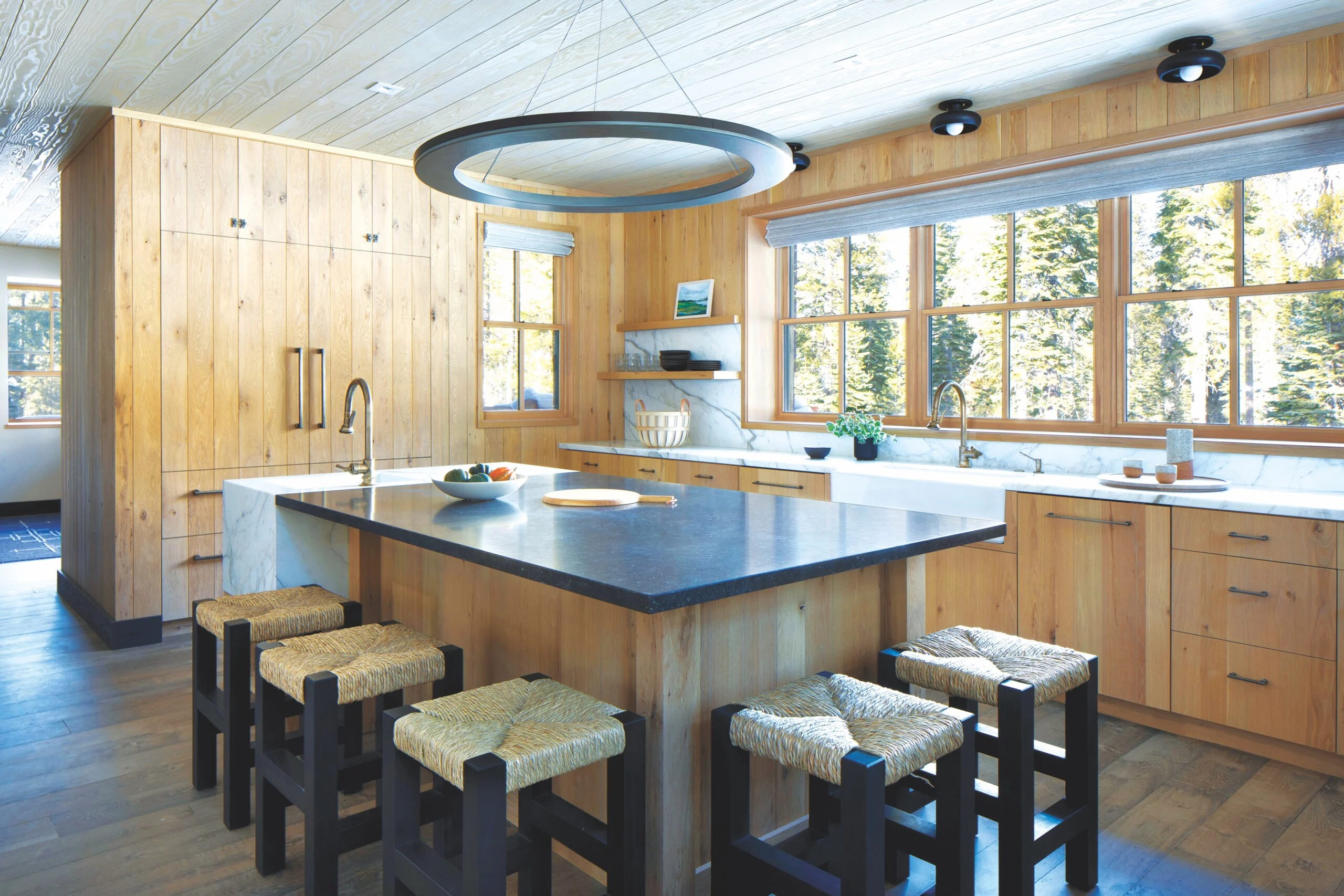 Minimal kitchen in warm wood and stone